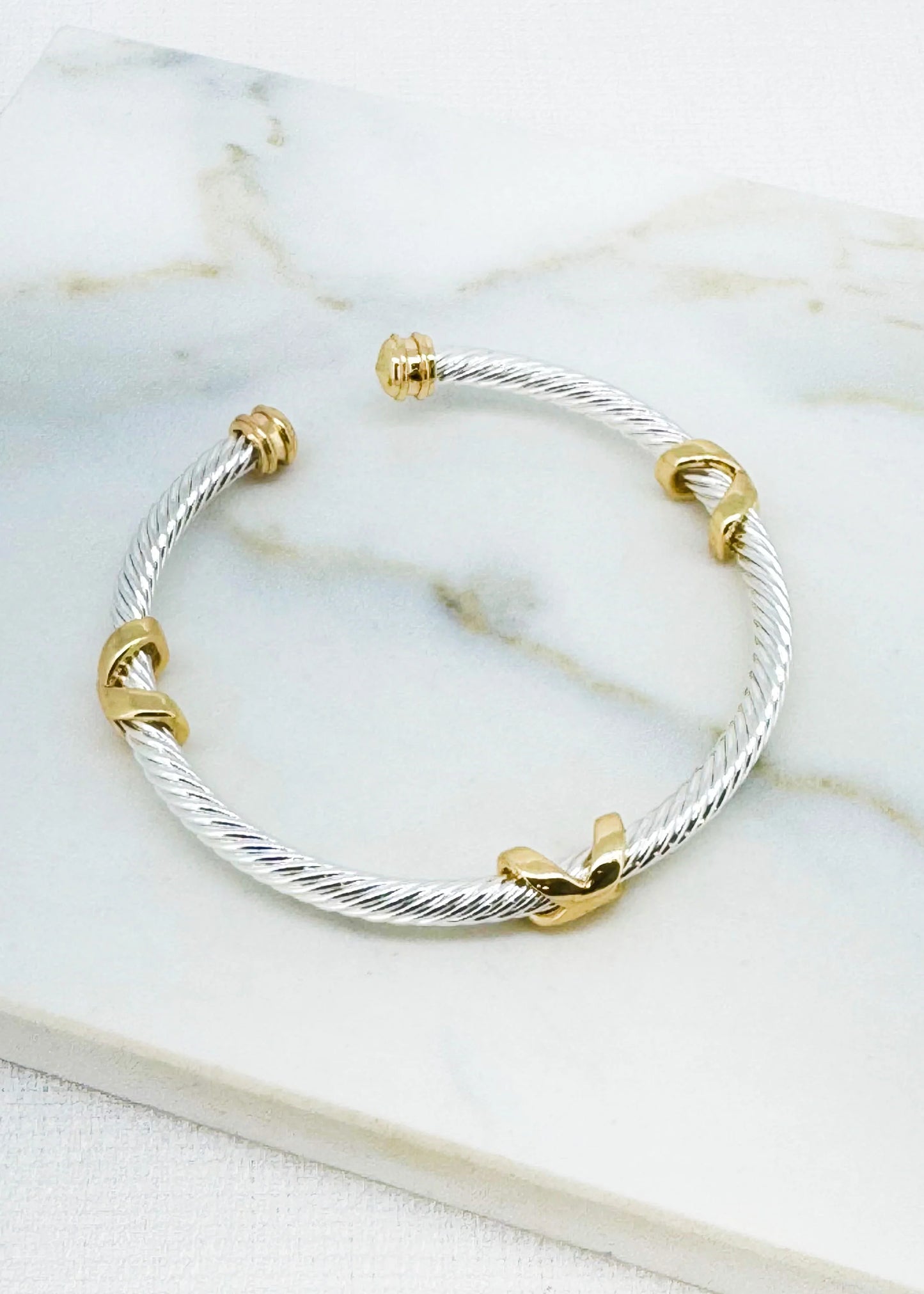 Textured silver and gold two tone bangle with kiss design