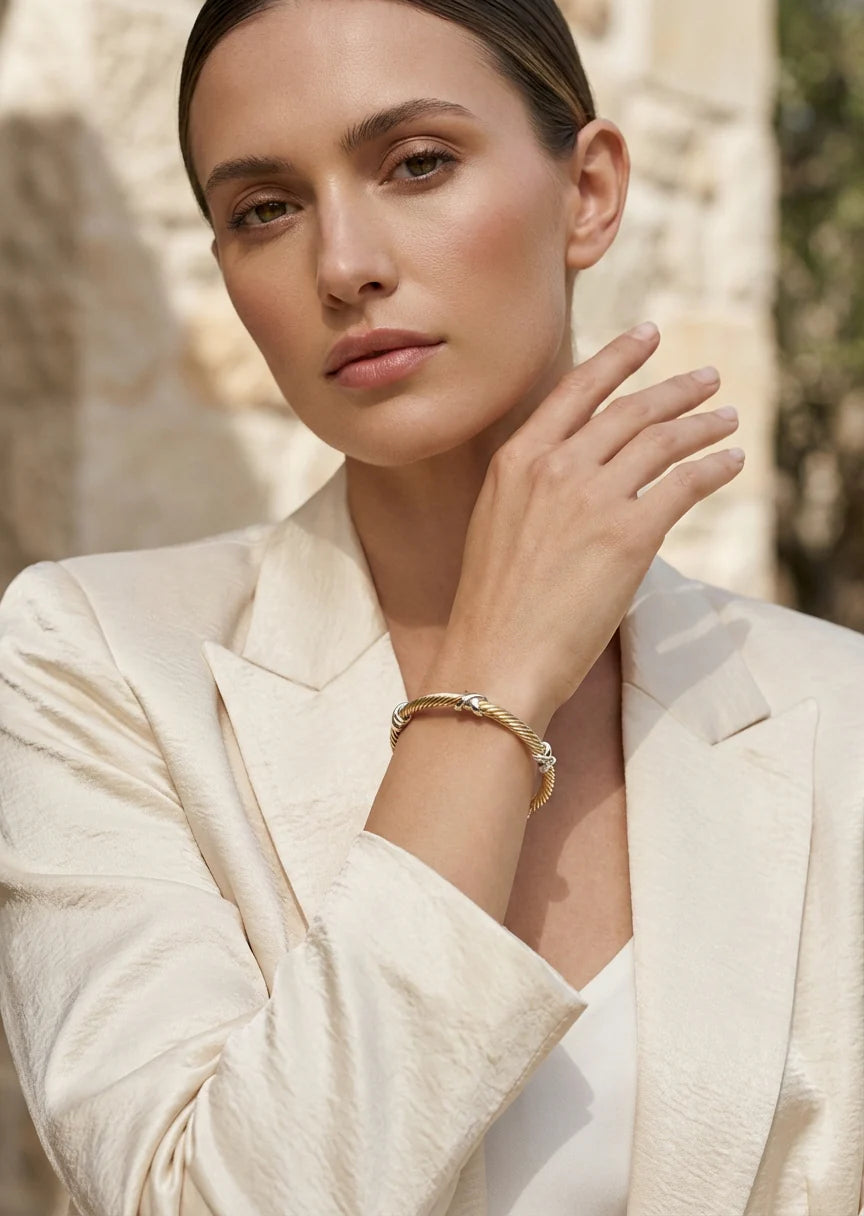 Textured silver and gold two tone bangle with kiss design